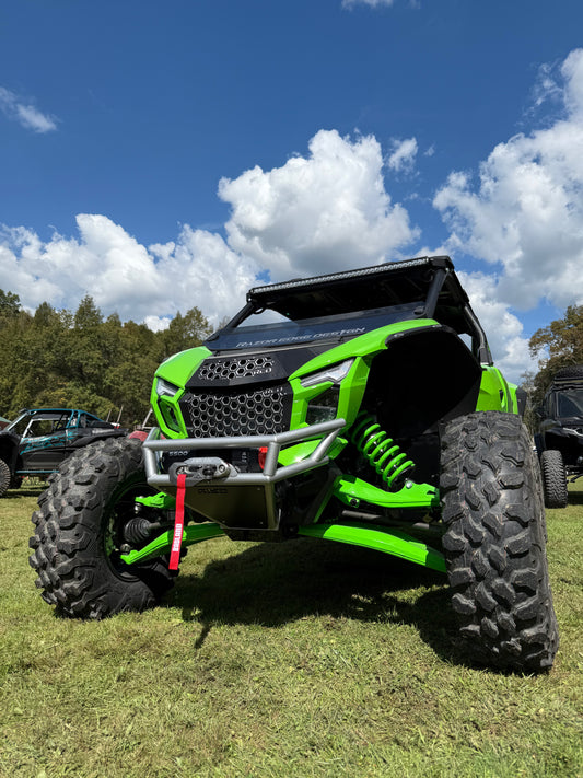 Kawasaki Teryx H2 front winch bumper installed with winch and red tow strap, front three-quarter view
