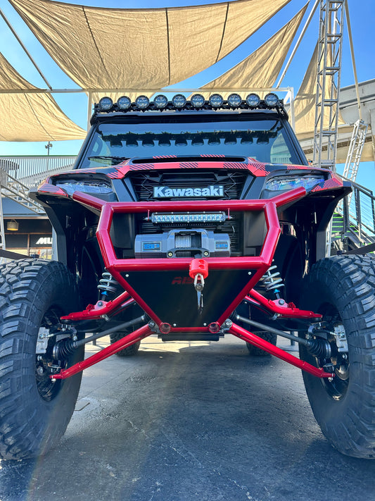 Front view of Area 15 Designs RIDGE Front Bumper mounted on Kawasaki RIDGE, showing 1.75" DOM tube construction and centered aluminum skid plate.