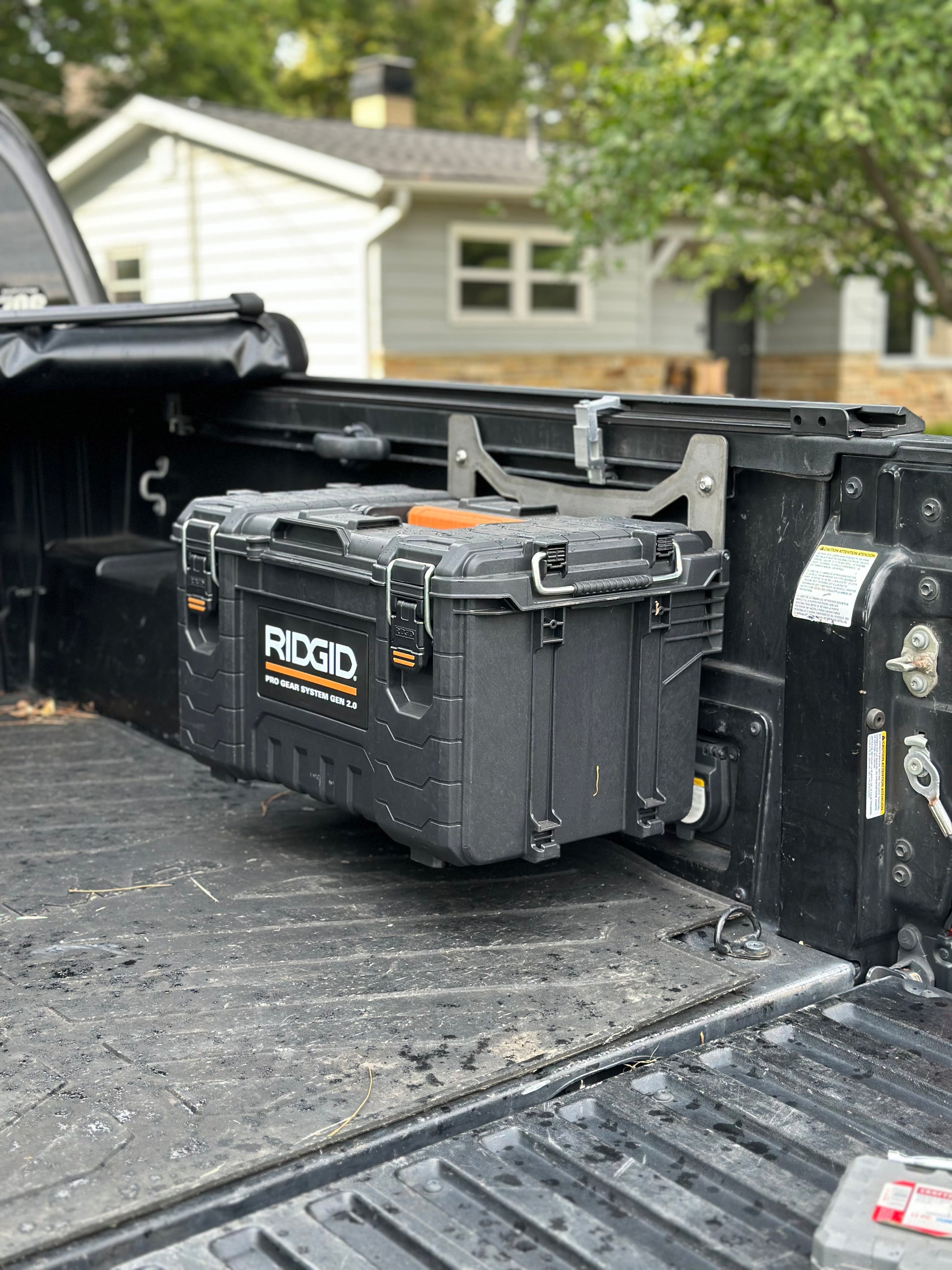 Area 15 Designs Rigid Pro Gear 22in Toolbox Bracket mounted on Toyota Tacoma bed rail system, showing secure fit and clean, organized installation.