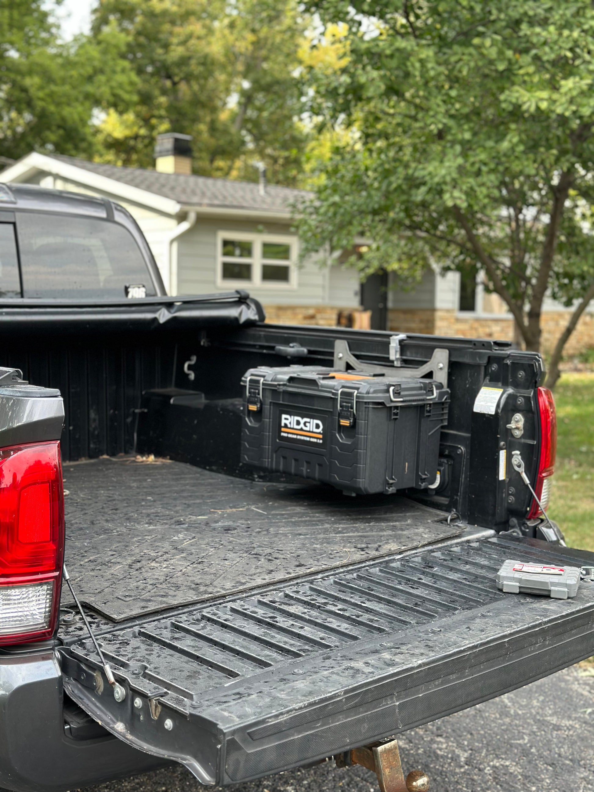 Area 15 Designs Rigid Pro Gear 22in Toolbox Bracket mounted on the Toyota Tacoma bed rail system, showing secure fit and clean, organized installation.